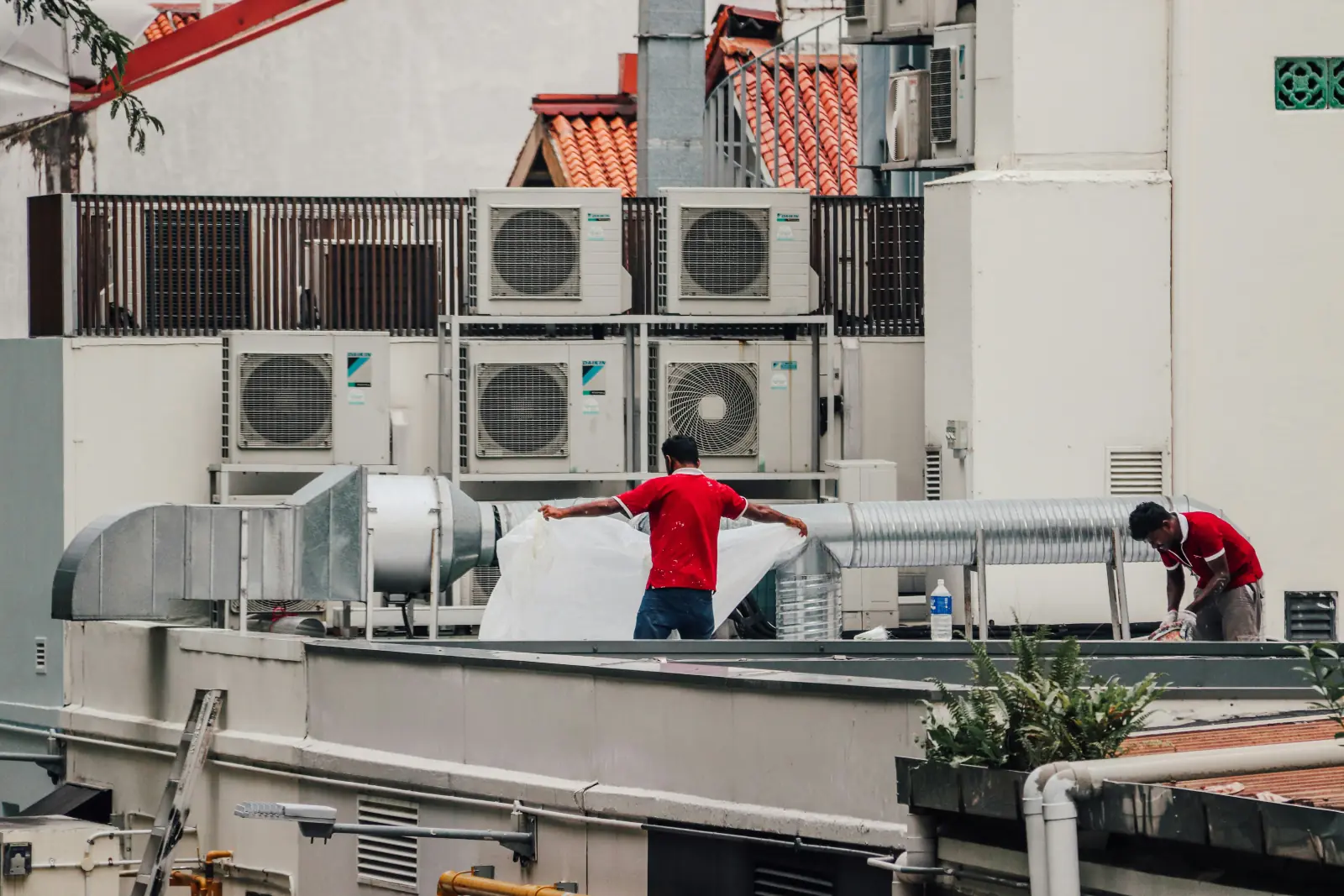 Our AC technicians servicing rooftop air-conditioning units in Dubai